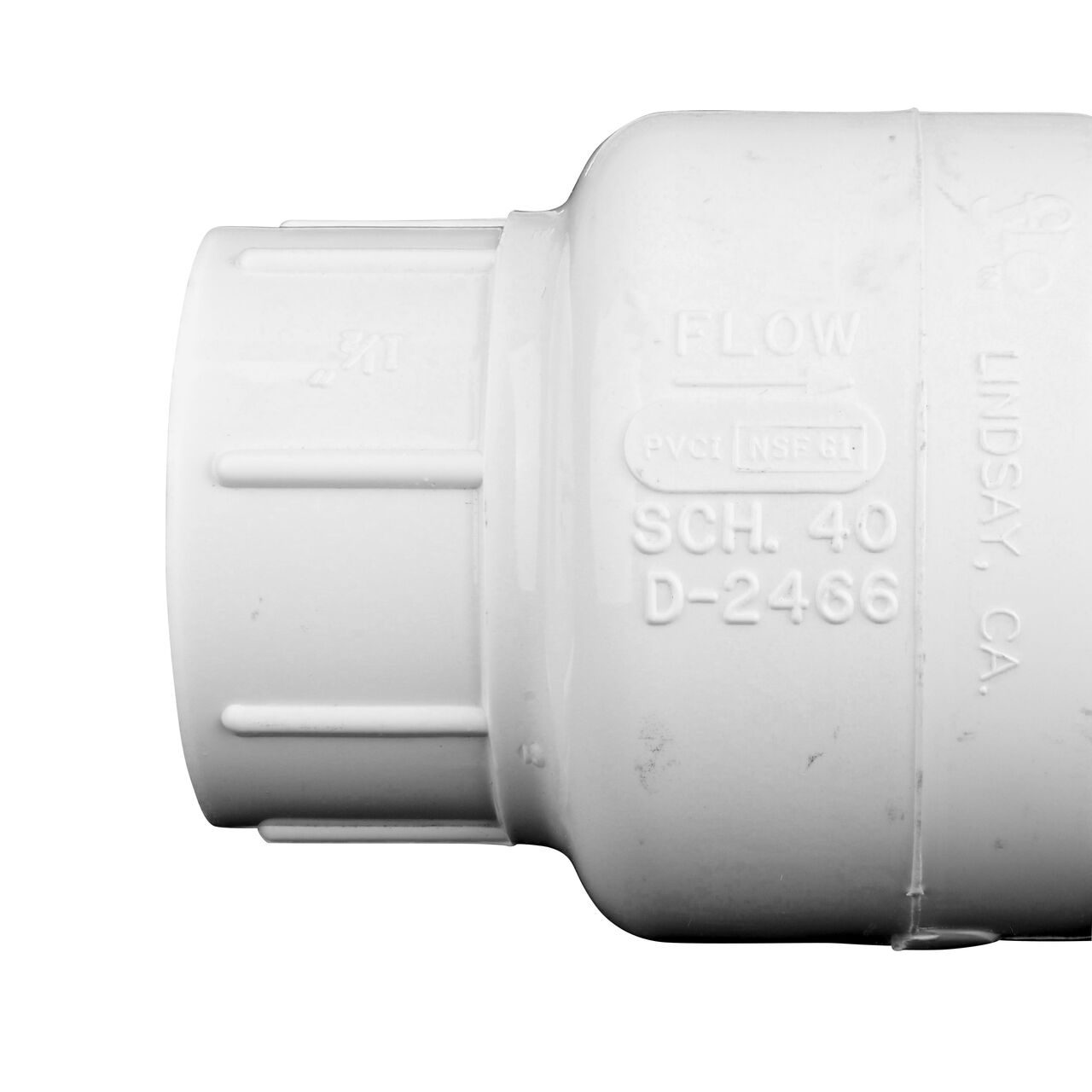 Closeup of the arrow showing water flow on the NDS White 1-1/2 in. slip end by slip end PVC Swing Check Valve (NDS 1520-15)
