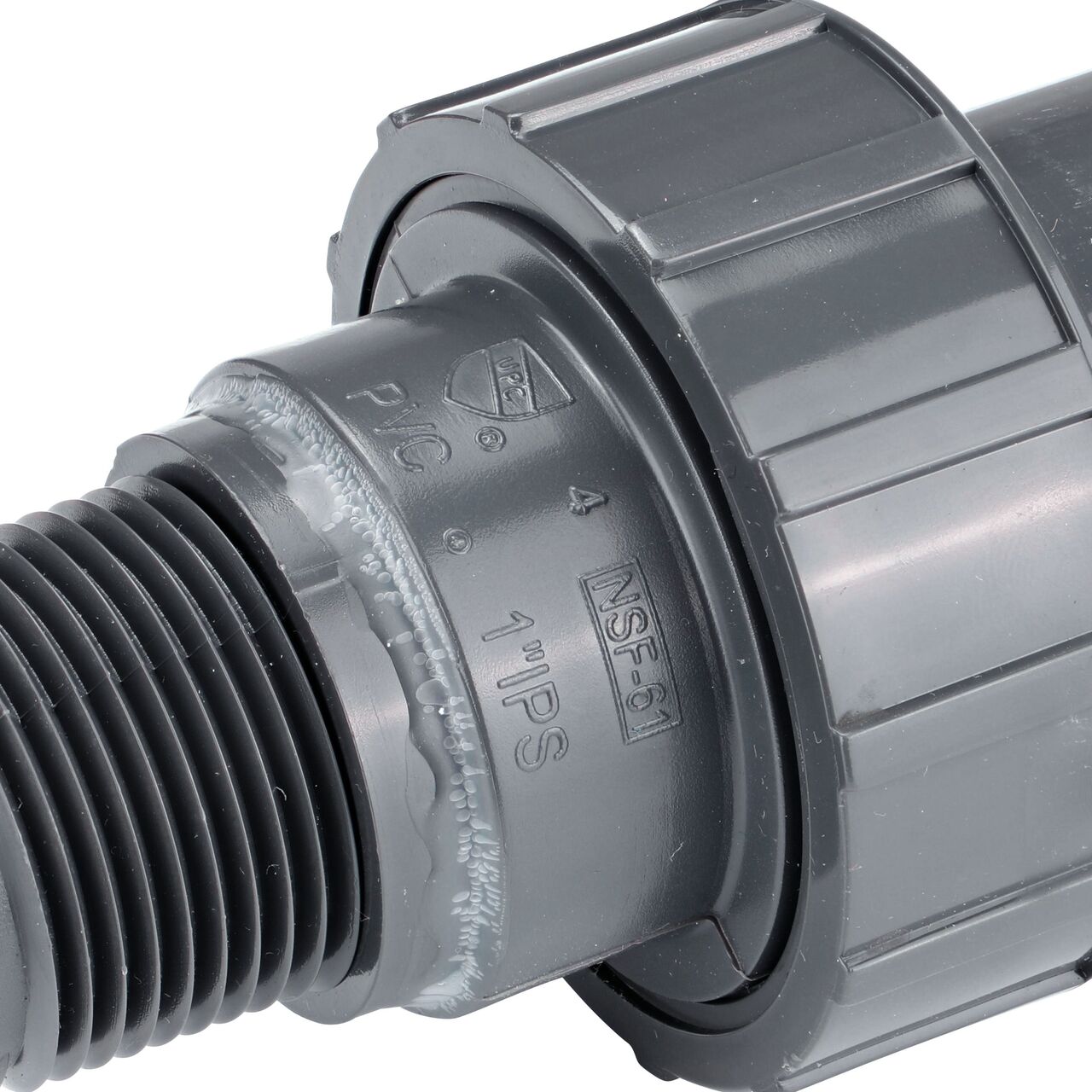Closeup view of the writing on the NDS 1 in. PVC slip X threaded Union showing the threaded end for residential, commercial, and industrial applications (NDS U-1000-SM)