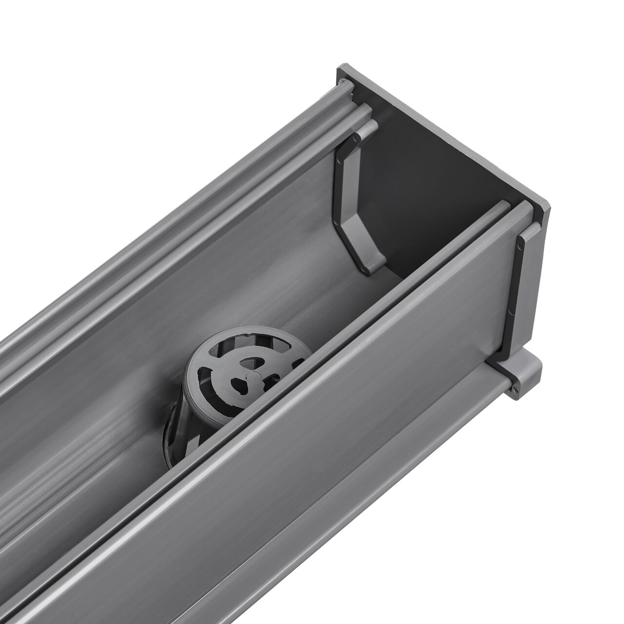 A different angle of the NDS Mini Channel™ Drain Bottom Outlet (NDS 550) with NDS Mini Channel end cap (NDS 547) installed to stop the flow of water and have it go down the bottom outlet through the pipes (NDS 550)