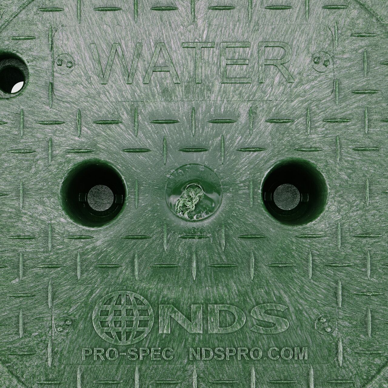 Closeup view of the Water markings on the Green Water cover (NDS 312BCW) for the NDS 10 in. Round Pro-Spec® Series Valve Box