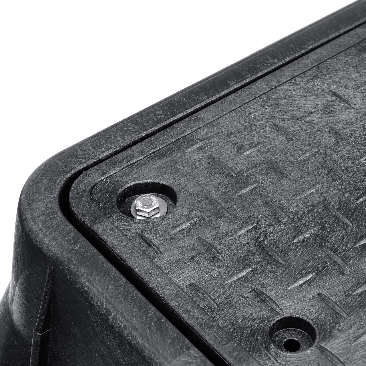 The valve box lid securely in place on the NDS 13 in. X 24 in. Rectangular Standard Series Black Box and Black Water Meter Cover with Bolt (NDS 125BCDMCIFB) keeping components protected against the elements, foot traffic, lawn care equipment, and potential vandalism while keeping them out of sight
