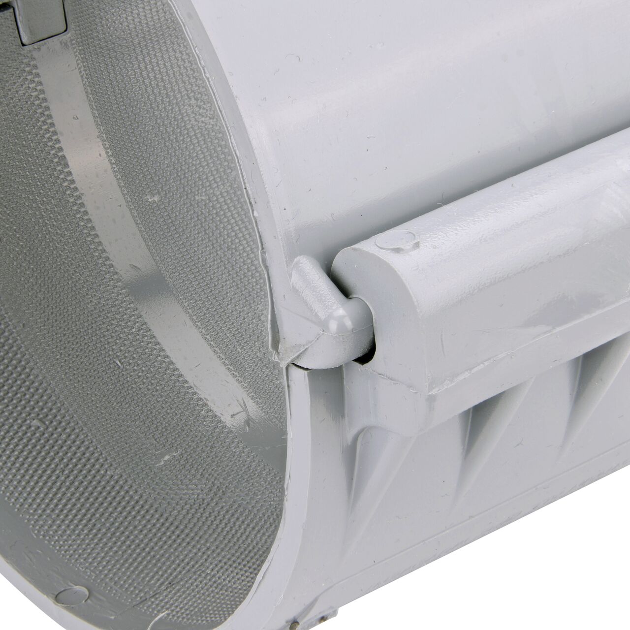 Closeup of the hinge closed on the NDS Clamp-It™ Rigid PVC Saddle with 2 in. slip connection on top (NDS 456020) for 6 in. PVC pipe