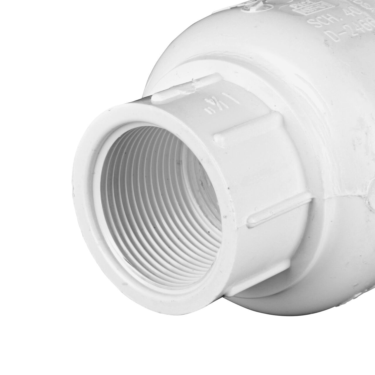 Closeup of the inlet end of the slip NDS White 1-1/4 in. female end by female end PVC Swing Check Valve (NDS 1520-12F) which prevents backflow in pipelines