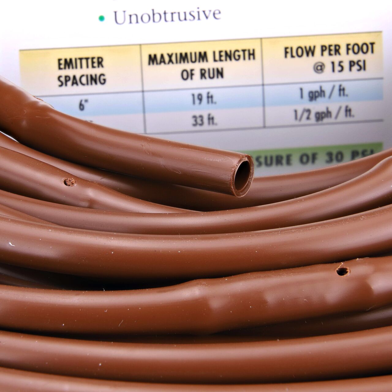 Closeup of the inside end to show how to pull out the dripline of the NDS Brown 100 ft. 1/4 in. Dura Flo™ JR Dripline with 12 in. spaced 0.5 GPH Non-Pressure Compensating Emitters (NDS SFJR-BL-12-01)