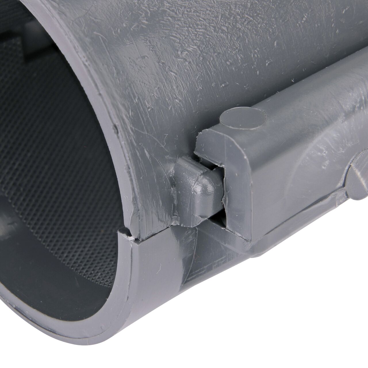 Closeup of the hinge closed on the NDS Clamp-It™ Rigid PVC Saddle for 2 in. PE pipe with 1 in. slip on top (NDS 332010P)