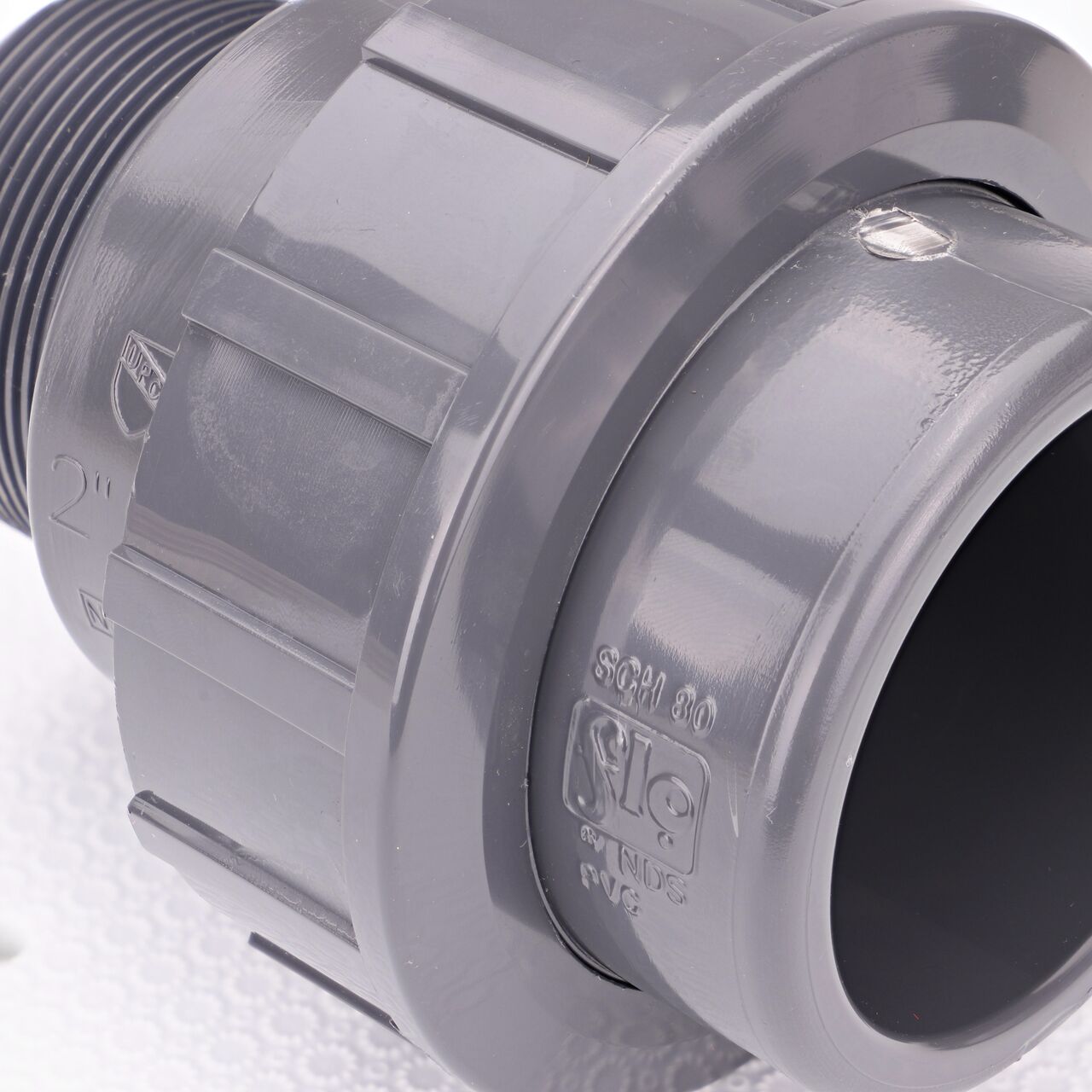 Close up view of the NDS 2 in. PVC S X MPT Union showing NDS brand, a leader in flow management solutions and the preferred choice of professionals since 1972 mark (NDS U-2000-SM)