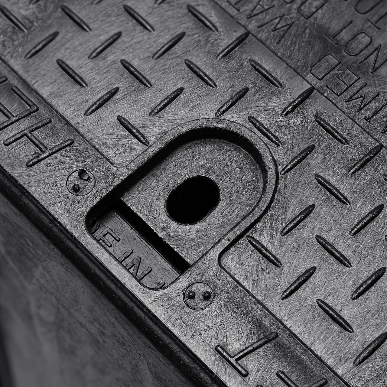 Closeup view of the Black box and Black cover fully assembled, showing locking tabs, bolt hole connection point and reinforced edges on the side of the NDS name of product (NDS 313BCBRBLK)