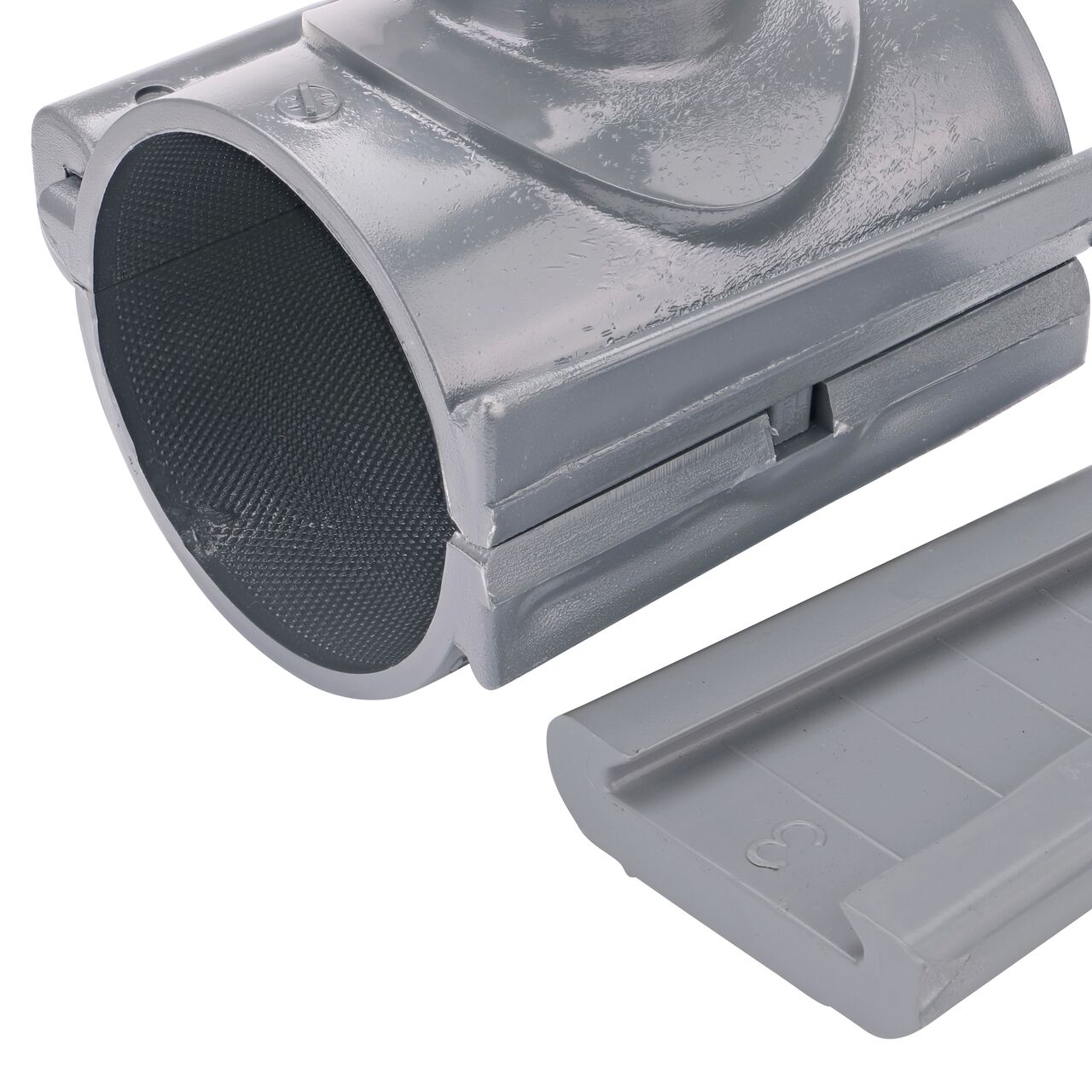 Closeup of the wedge latch uninstalled on the NDS Clamp-It™ Rigid PVC Saddle with 1-1/4 in. FPT connection on top (NDS 443012) for 3 in. PVC pipe