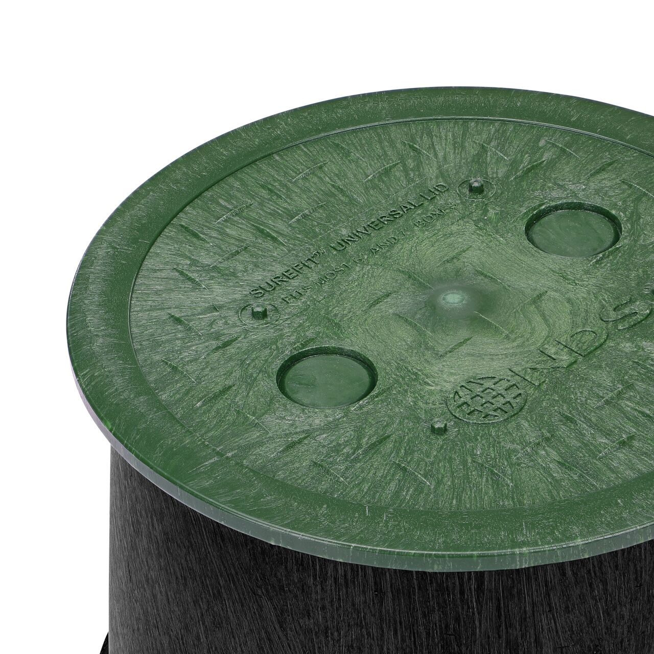 Closeup of the 6 in. Round SureFit Universal Valve Box Lid (NDS 6RND-UC) installed on a 7 inch green Oldcastle valve box