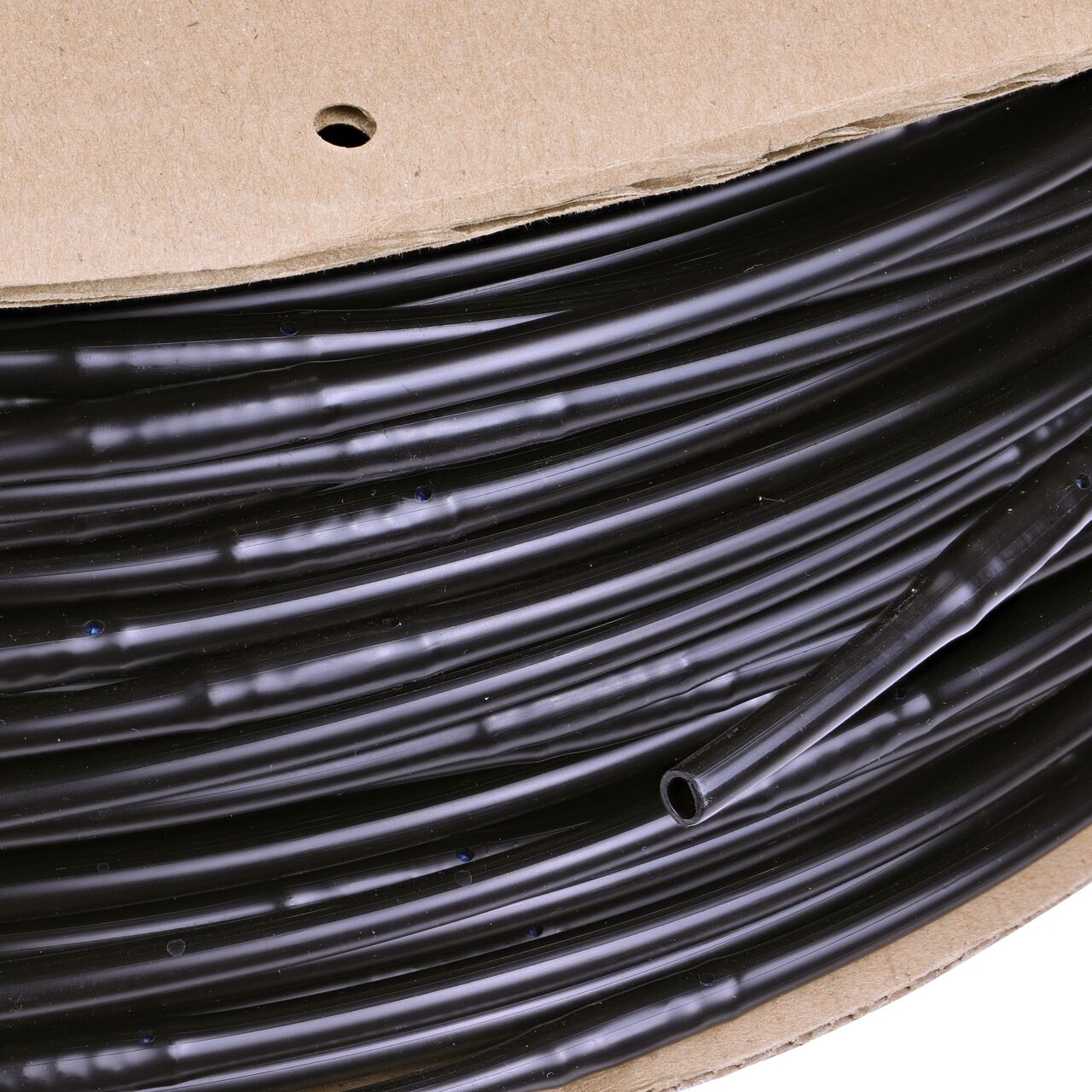 Closeup of the outside end of the NDS 1,000 ft. 1/4 in. Dura Flo™ JR Dripline with 6 in. spaced 0.5 GPH Non-Pressure Compensating Emitters (NDS SFJR-BL-06-10)
