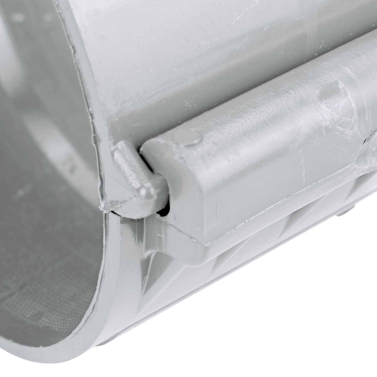 Closeup view of the hinge on the 6 in. NDS Flo-Tap™ Rigid PVC saddle with 1-1/2 in. socket or 2 in. spigot in the closed position  (NDS 3260)