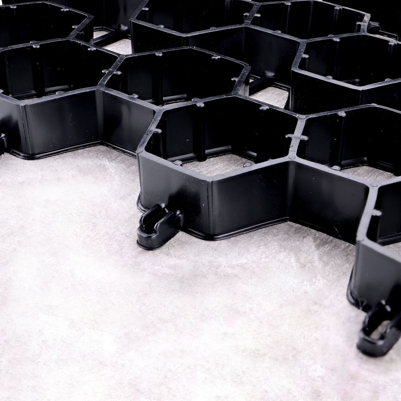 Closeup view of the end to end locking mechanism on the Black NDS EZ Roll® Gravel Paver (NDS GP4X150)