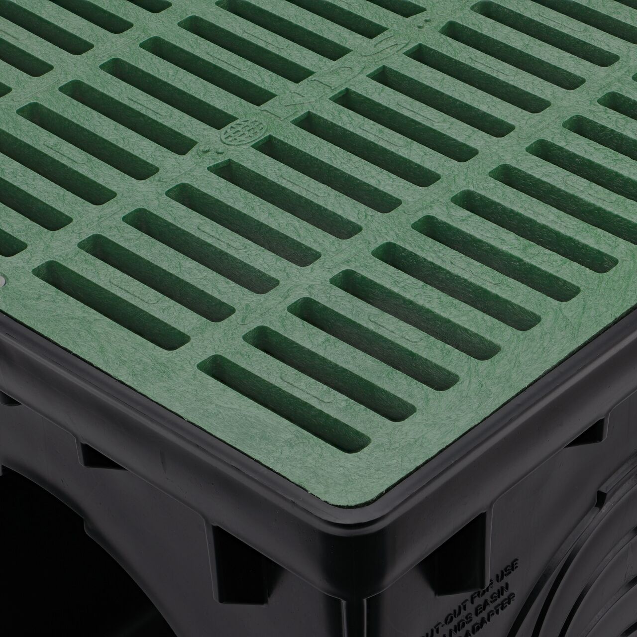 The green plastic NDS 12 in. Square Catch Basin Drain Grate (NDS 1212) fits snugly in the NDS 12 in. Square Catch Basin Drain (NDS 1200)