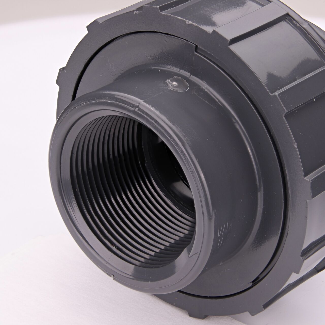 Closeup view of one threaded end on the PVC Union, 1-1/2 in. Sch. 80 S X FPT (NDS U-1000-ST)