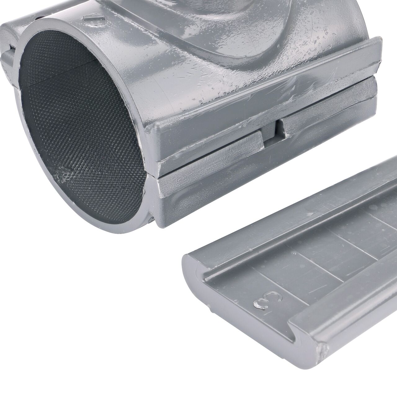 Closeup of the wedge latch uninstalled on the NDS Clamp-It™ Rigid PVC Saddle with 2 in. slip connection on top (NDS 453020) for 3 in. PVC pipe