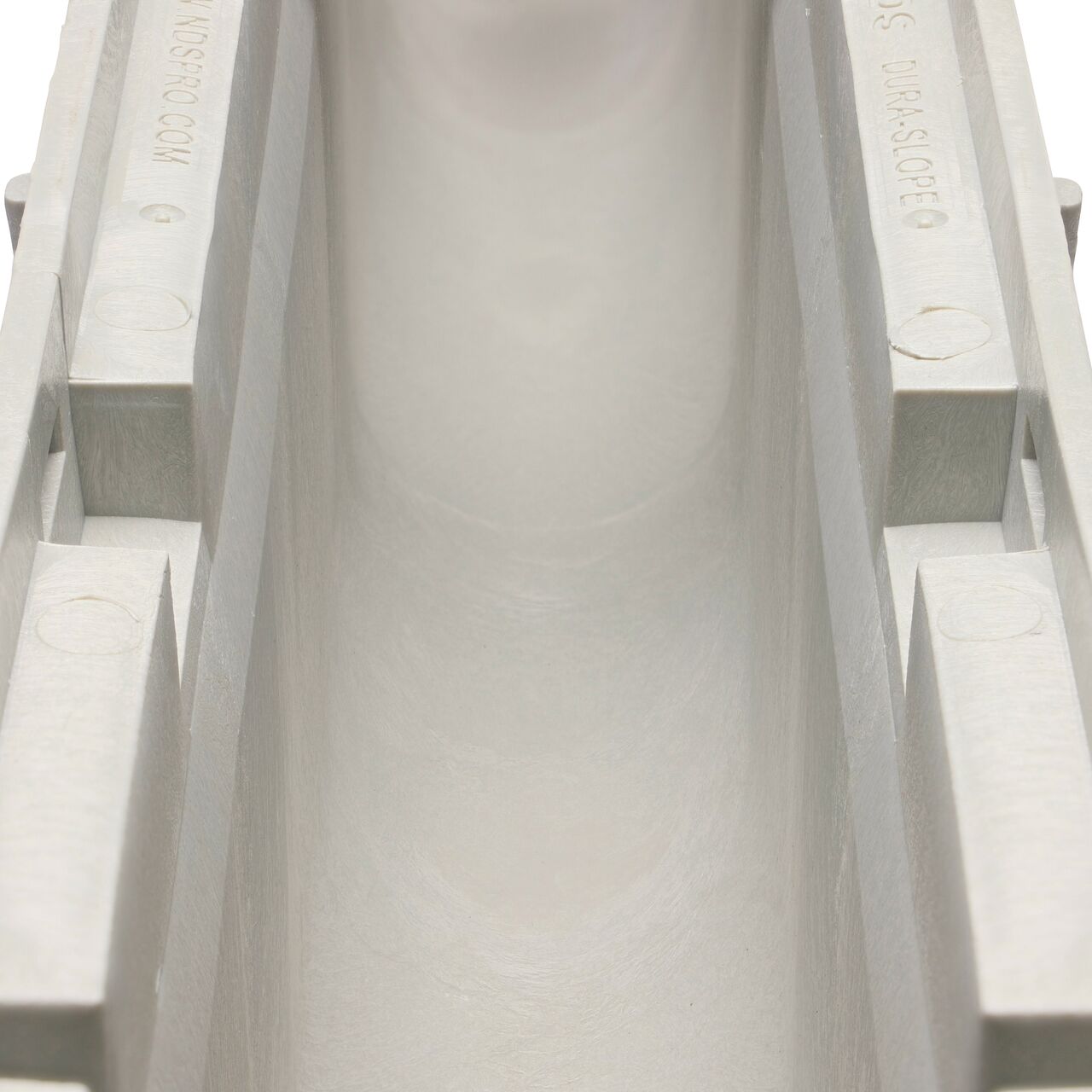 Closeup view of the grooved interior on the NDS Dura Slope Channel Drain, which supports and secures grates with the grate locking system (NDS DS-106N)