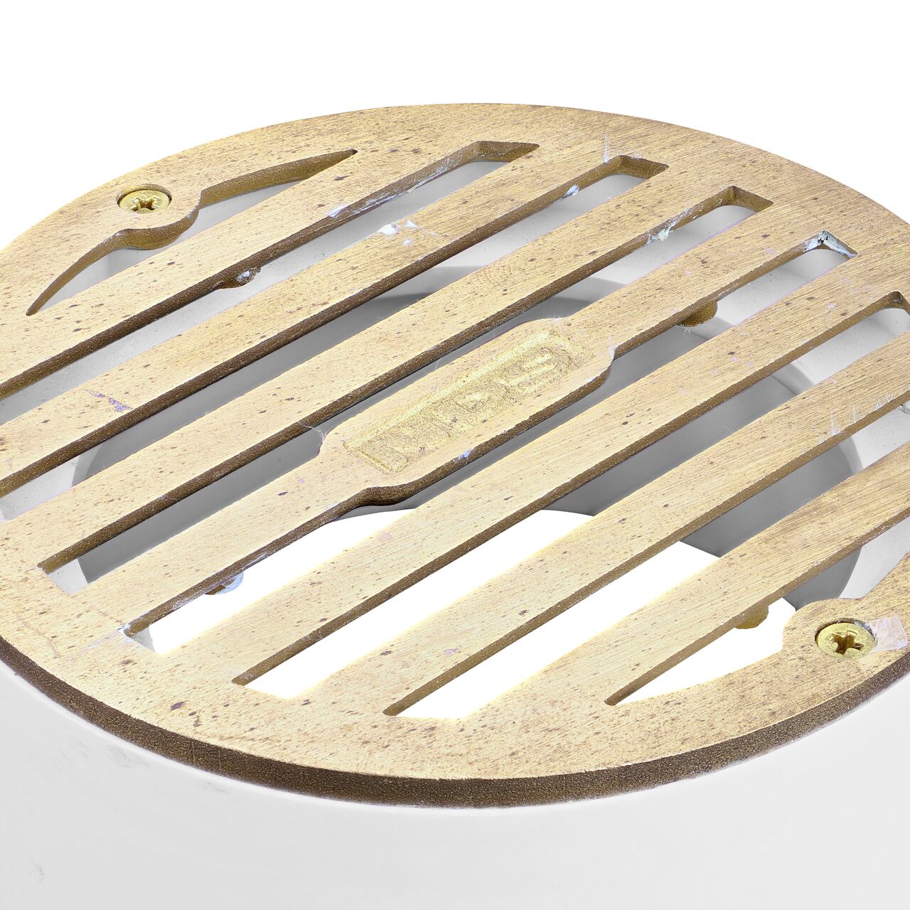 Closeup of the grate design of the NDS 4 in. Satin Brass & Plastic Round Grate (NDS 910B)