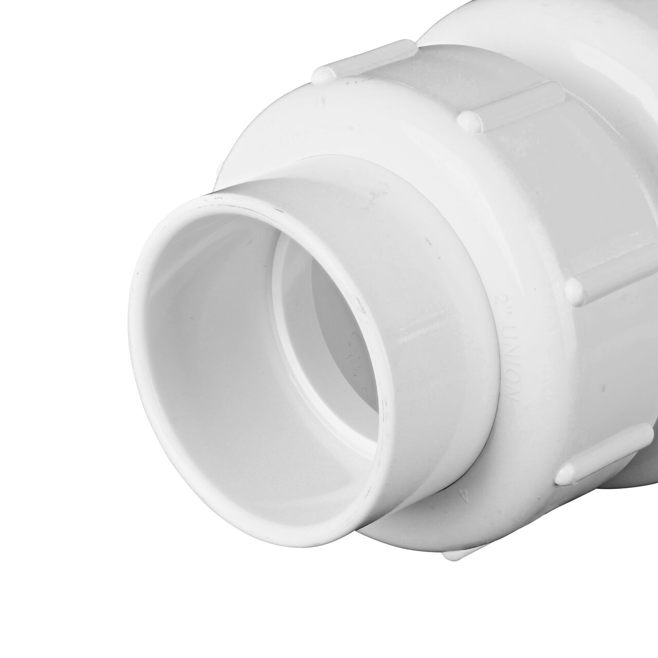 Closeup of the inlet end of the NDS White 2 in. union end by union end PVC True Union Swing Check Valve (NDS 1720-20) which prevents backflow in pipelines