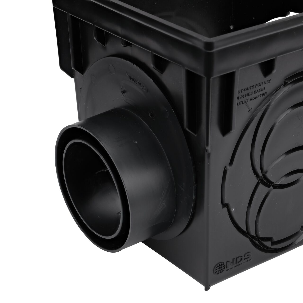 The NDS Offset Outlet Adapter (NDS 1245) installed on an NDS 9 in. Catch Basin Drain (NDS 900) with the offset/outlet in the bottom position