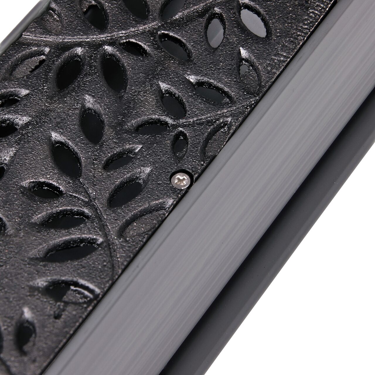 Closeup of #4 X 5/8 in. Phillips Flat Head Screw securing cast iron botanical grate to Mini Channel (NDS 529)