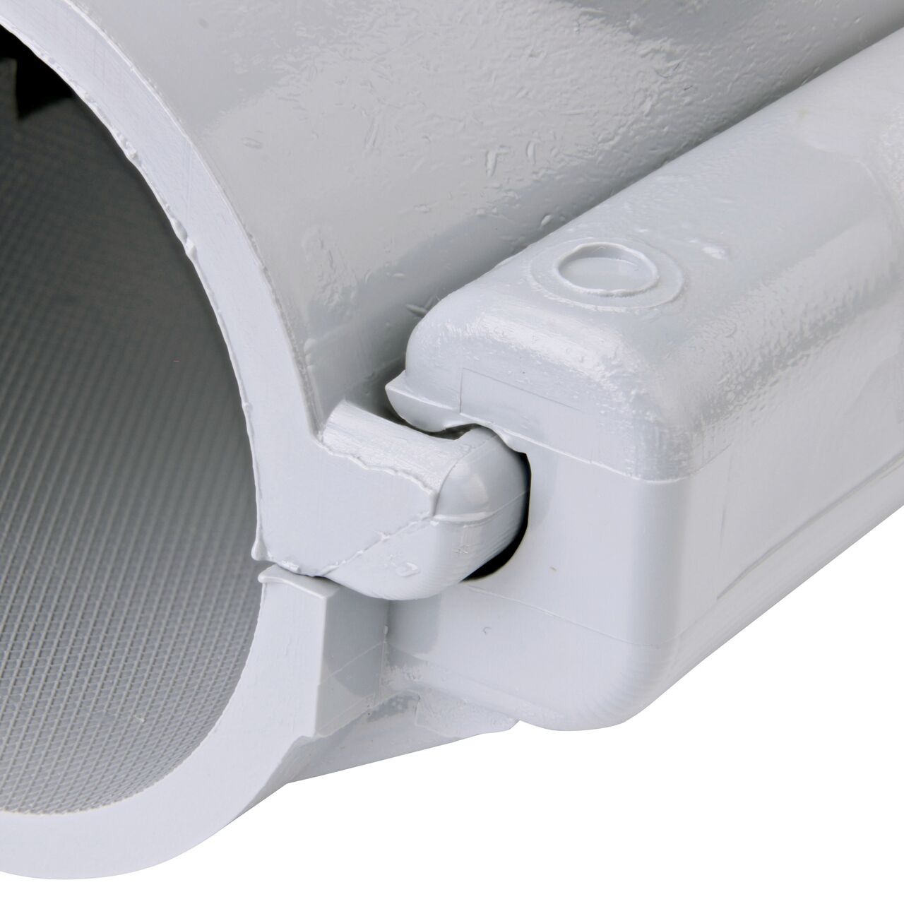 Closeup of the hinge closed on the NDS Clamp-It™ Rigid PVC Saddle with 3/4 in. FPT connection on top (NDS 422007) for 2 in. PVC pipe
