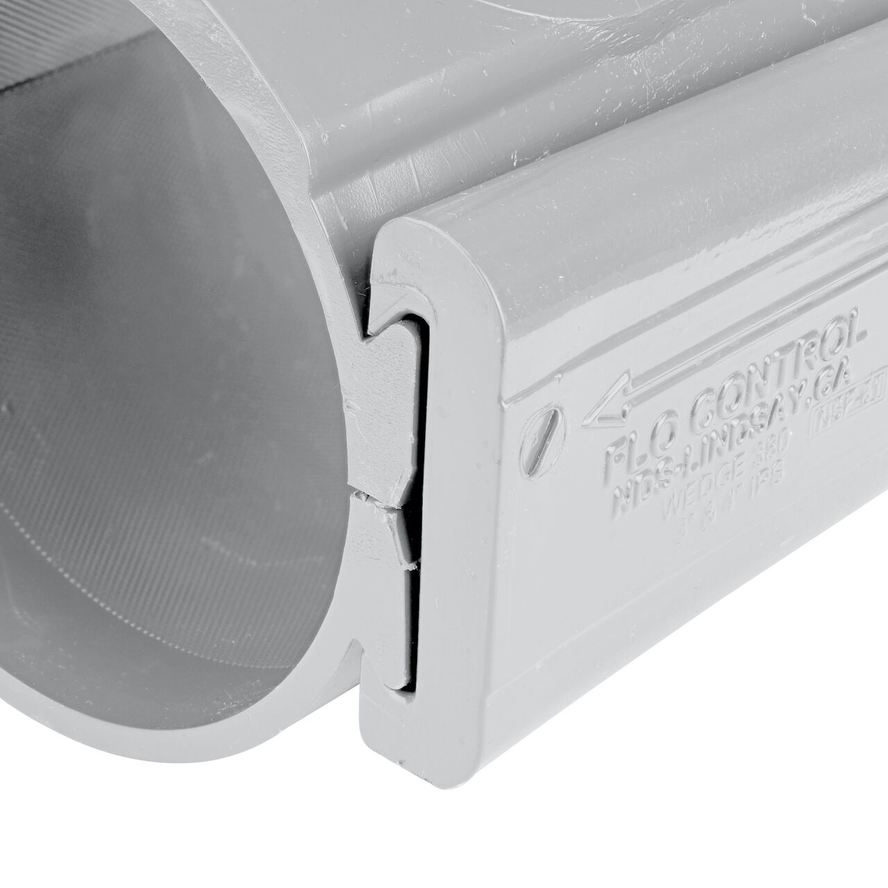 Closeup view of the wedge securely in the closed position on the 4 in. NDS Flo-Tap™ Rigid PVC saddle with 1-1/2 in. socket or 2 in. spigot (NDS 3240)