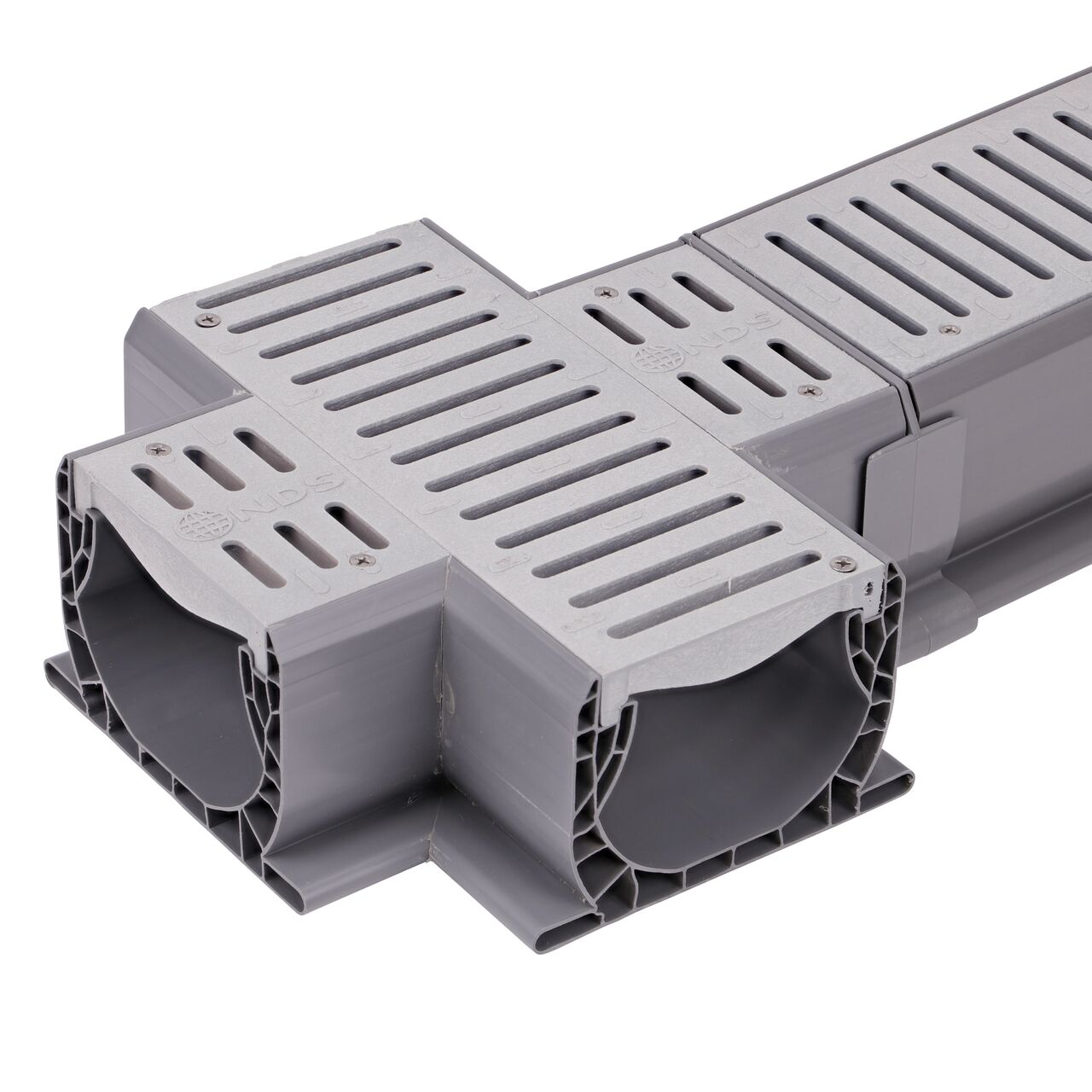 Connect the length on the Spee-D® Channel Drain and Grate with Cross (NDS 2361) to the longer Spee-D® Channel Drain (NDS 400, NDS 400-10, NDS 400-10WH) with the Spee-D® Channel Drain Coupling (NDS 248)