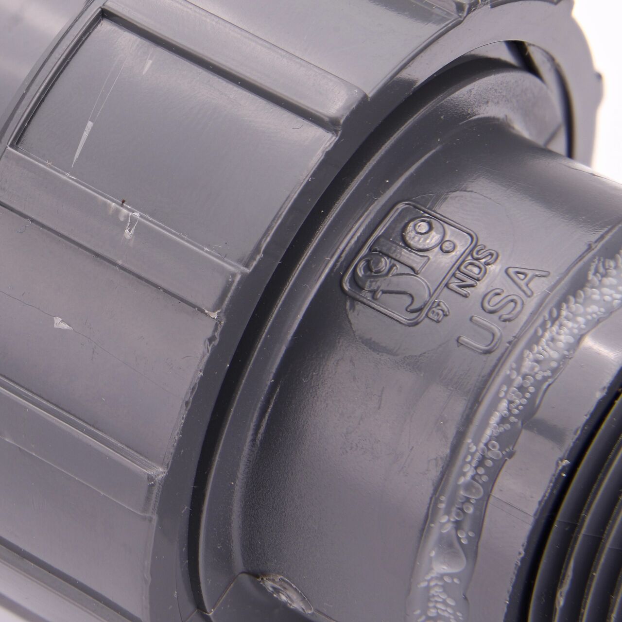 Close up view of the PVC Union, 1 in. Sch. 80 FPT X MPT showing NDS brand a leader in flow management solutions and the preferred choice of professionals since 1972 mark (NDS U-1000-TM)