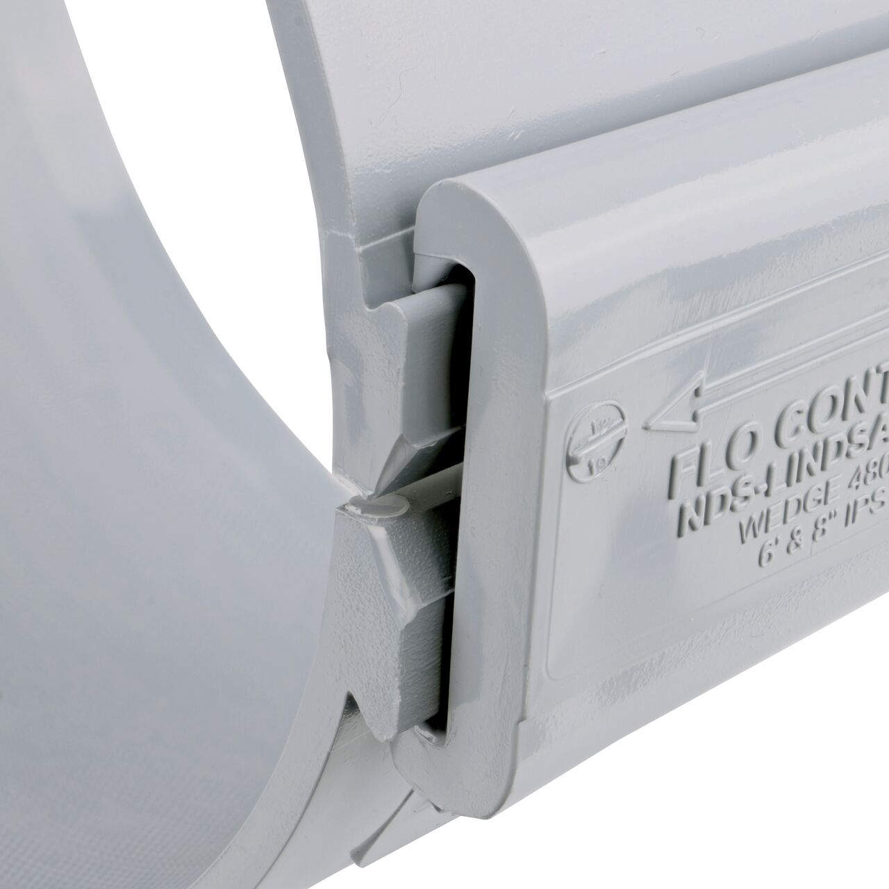 Closeup of the wedge installed securely on the NDS Clamp-It™ Rigid PVC Saddle with 2 in. FPT connection on top (NDS 448020) for 8 in. PVC pipe