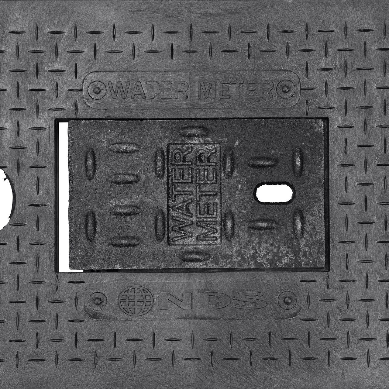 Closeup view of the Water Meter markings and cast iron reader door on the Cast Iron Water Meter Drop-In cover for the NDS 14 in. X 19 in. Rectangular Standard Series Meter Box (NDS D1200-DICIRTRL)