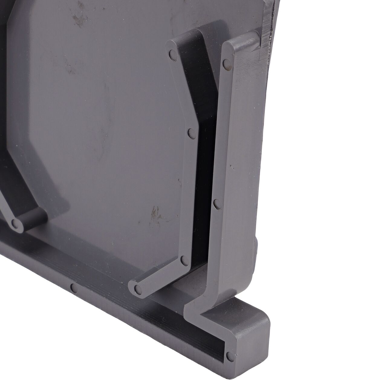 Closeup of the locking mechanisms of the NDS Gray Mini Channel™ Drain End Cap (NDS 547, NDS 547*)
