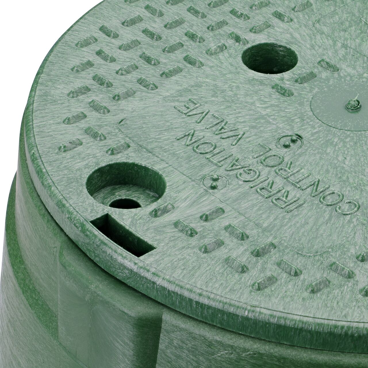 The valve box lid securely in place on the NDS 10 in. Round Standard Series Green Box and Green Irrigation Control Valve Cover (NDS 112BC) keeping components protected against the elements, foot traffic, lawn care equipment, and potential vandalism while keeping them out of sight