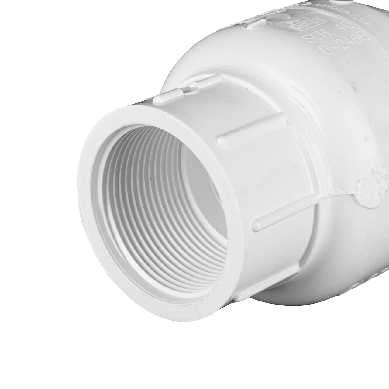 Closeup of the inlet end of the slip NDS White 1-1/2 in. female end by female end PVC Swing Check Valve (NDS 1520-15F) which prevents backflow in pipelines