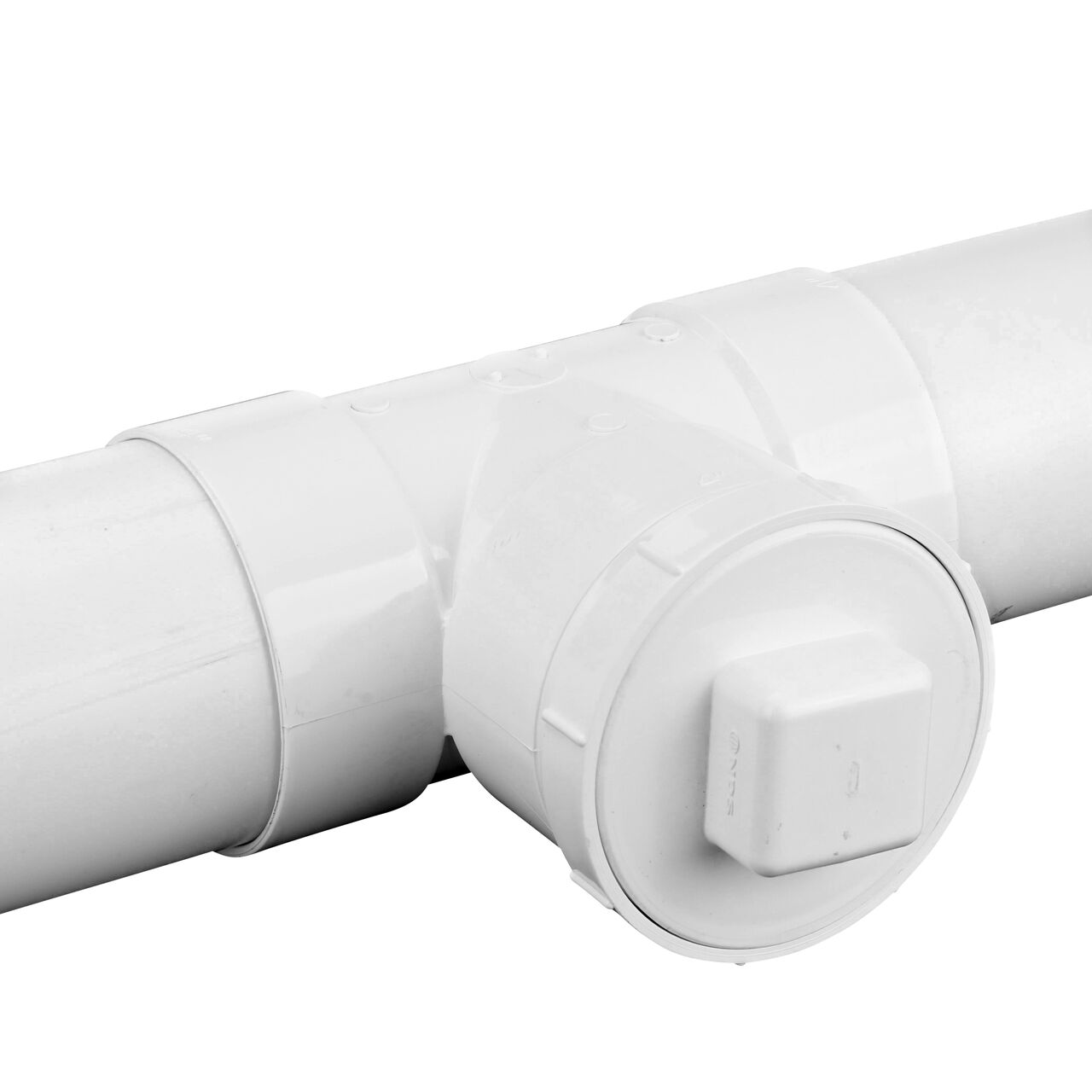 The NDS PVC tee for 4 in. Sewer and Drain pipes (NDS LP1104) with two 4 in. Sewer and Drain Pipes installed on the ends and a 4 in. MPT Plug (NDS 41P8) installed in the middle
