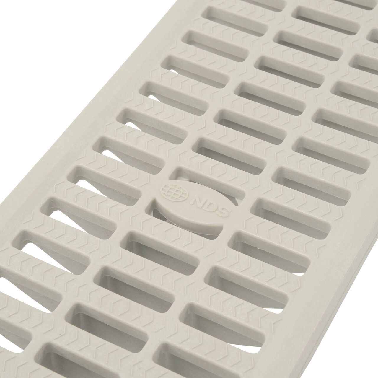 Angled close-up of grate openings on 8 in. Pro Series Channel Drain Grate in Gray Plastic (SKU 837)