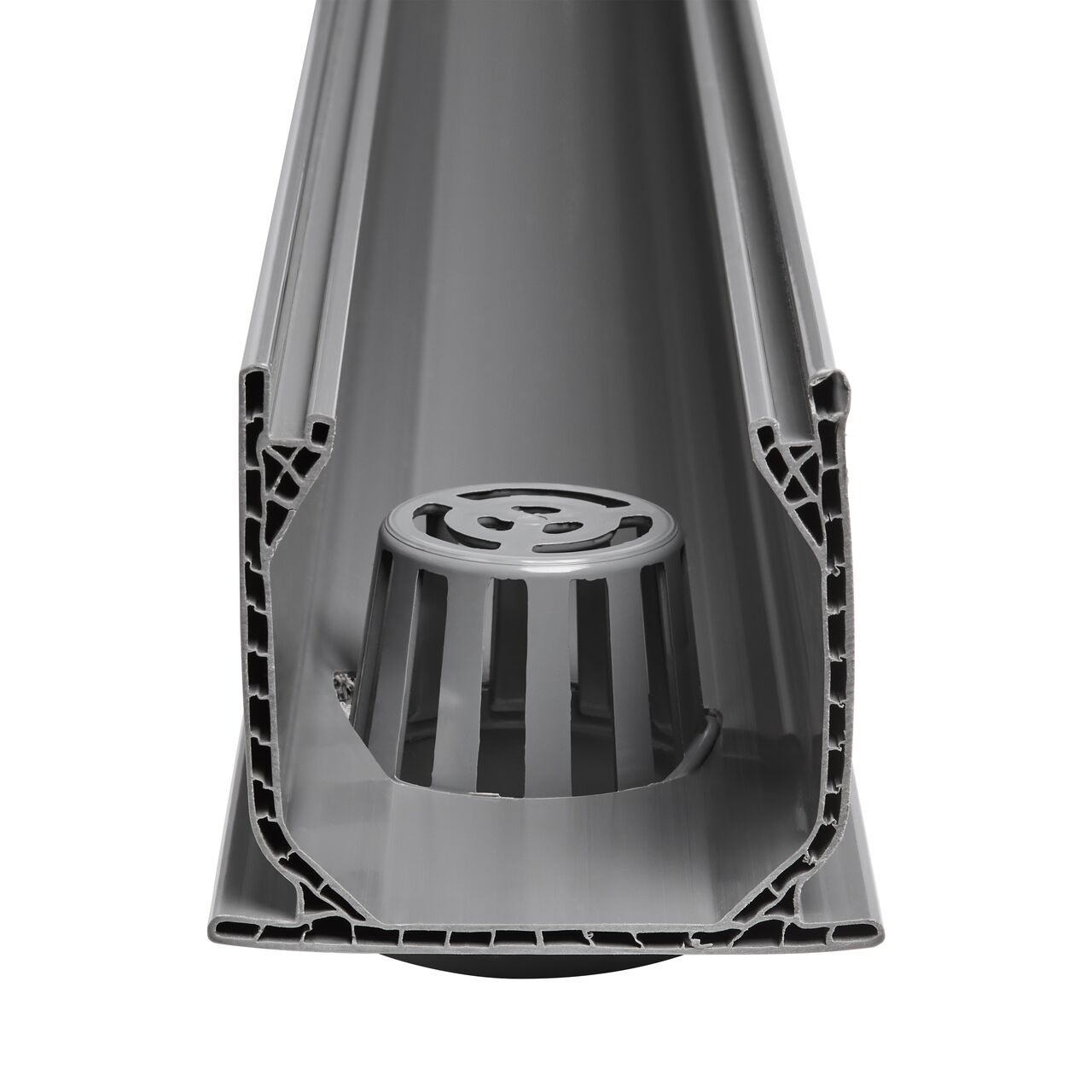 NDS Mini Channel™ Drain Bottom Outlet shown straight on highlights the drain within the channel drain which drains light flows of water and directs it to drain pipes (NDS 550)