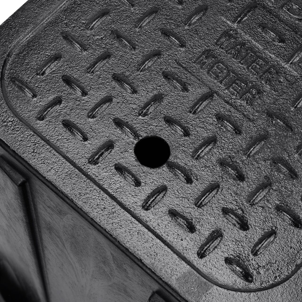 Closeup view of the pipe hole on the Black NDS 14 in. X 19 in. Rectangular Standard Series Meter Box (NDS D1200-CI) for water and irrigation pipe connections