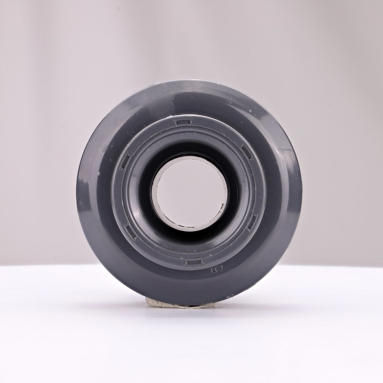 The inside of the PVC Union, 1 in. Sch. 80 FPT X MPT which allows water to flow through while preventing leaks and made of durable PVC plastic (NDS U-1000-TM)