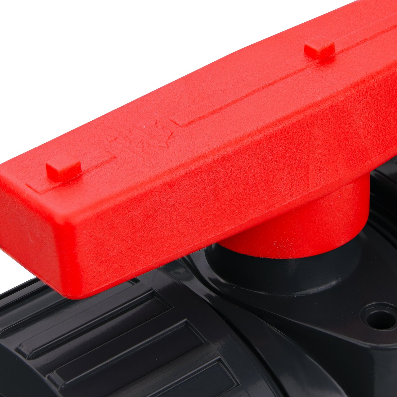 Closeup up view of the markings on the handle on the 2 in. PVC Slip & Threaded True Union Ball Valve (NDS BTU-2000-E) includings size and open and close.