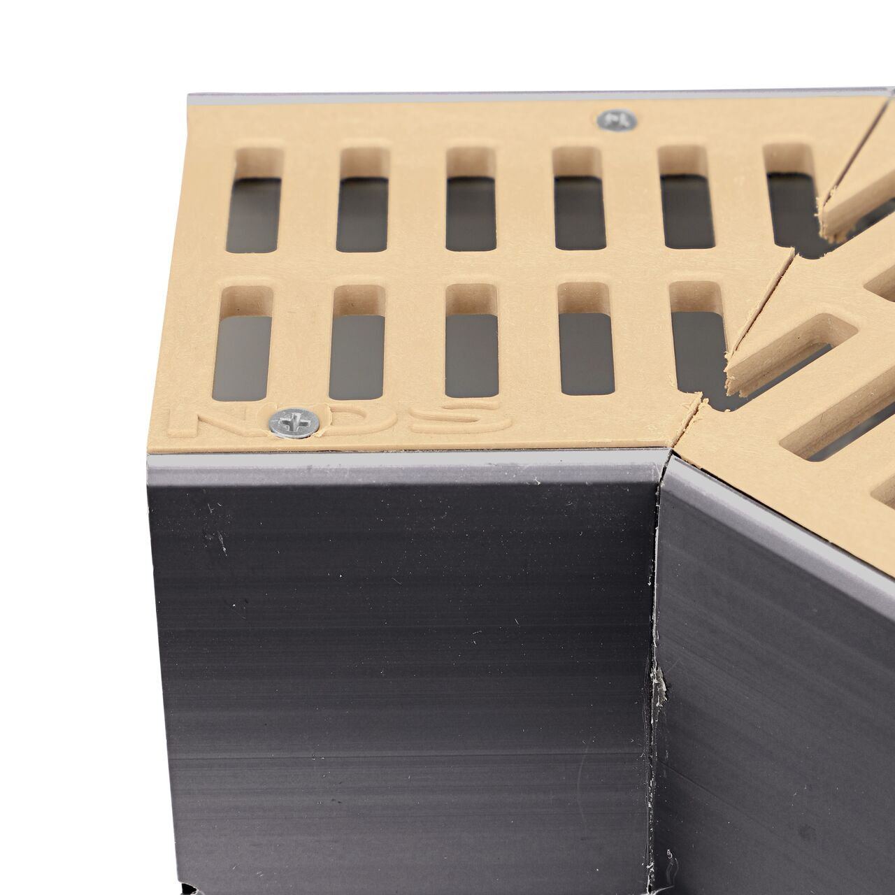 Closeup of any branding of the NDS Sand Mini Channel™ Drain 45 Degree Elbow and Grate (NDS 5303)