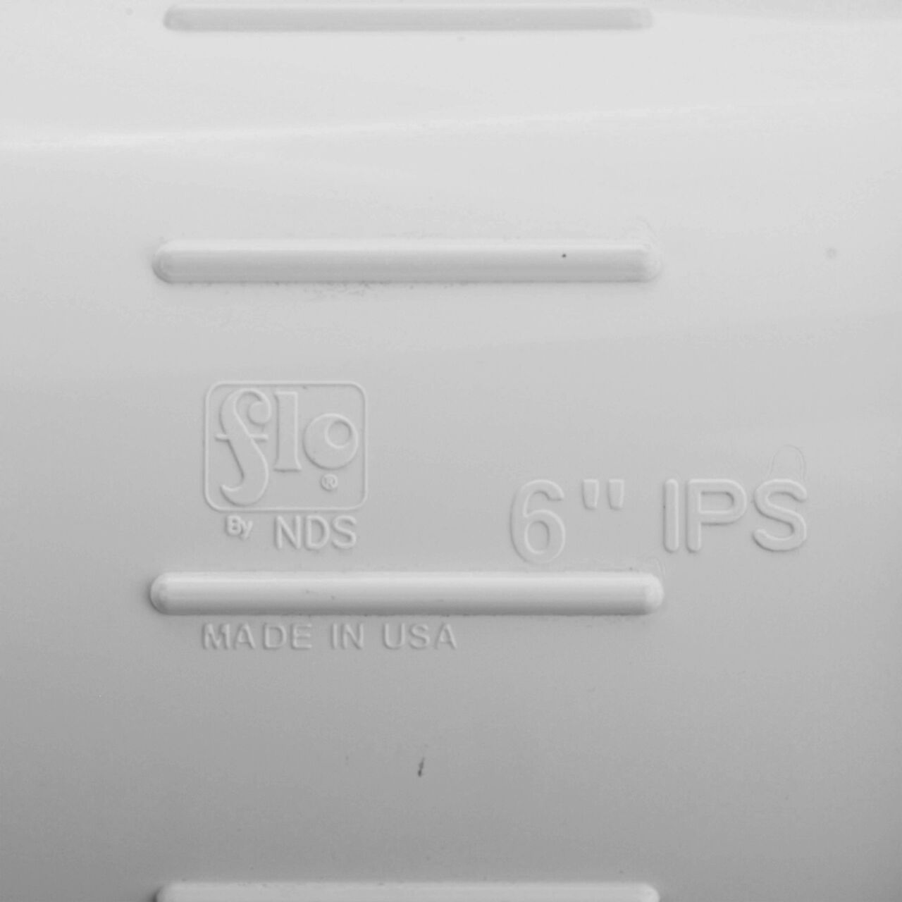 Closeup view of the NDS 6 in. IPS UC Compression Coupling showing that it is made in the USA as part of a complete flow management system for pool, spa, irrigation, and plumbing applications (NDS CPC-6000)