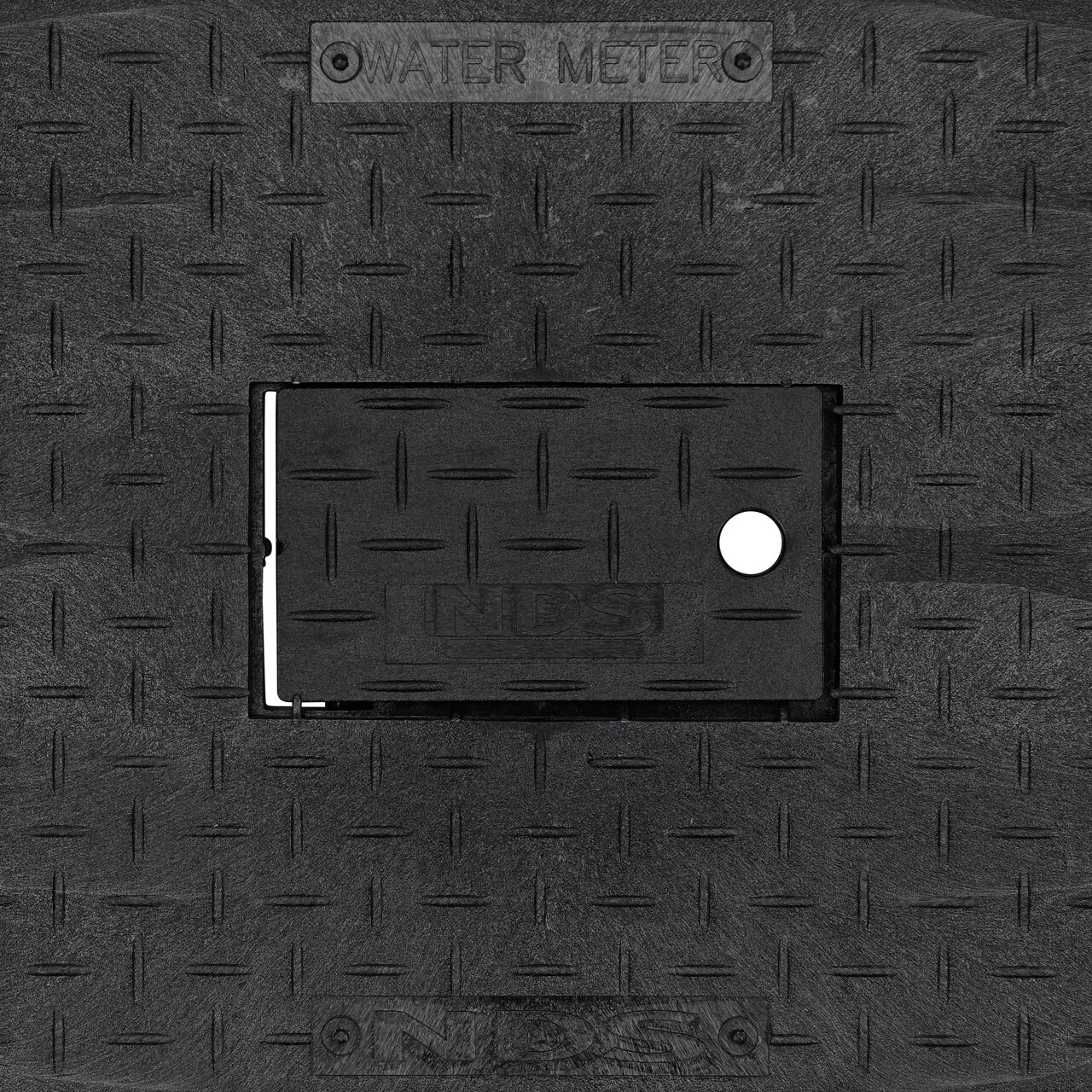 Closeup view of the Water Meter markings and plastic reader door on the Black Water Meter Drop-in cover for the NDS 13 in. X 20 in. Rectangular Standard Series Meter Cover (NDS D1500-DIRBL)