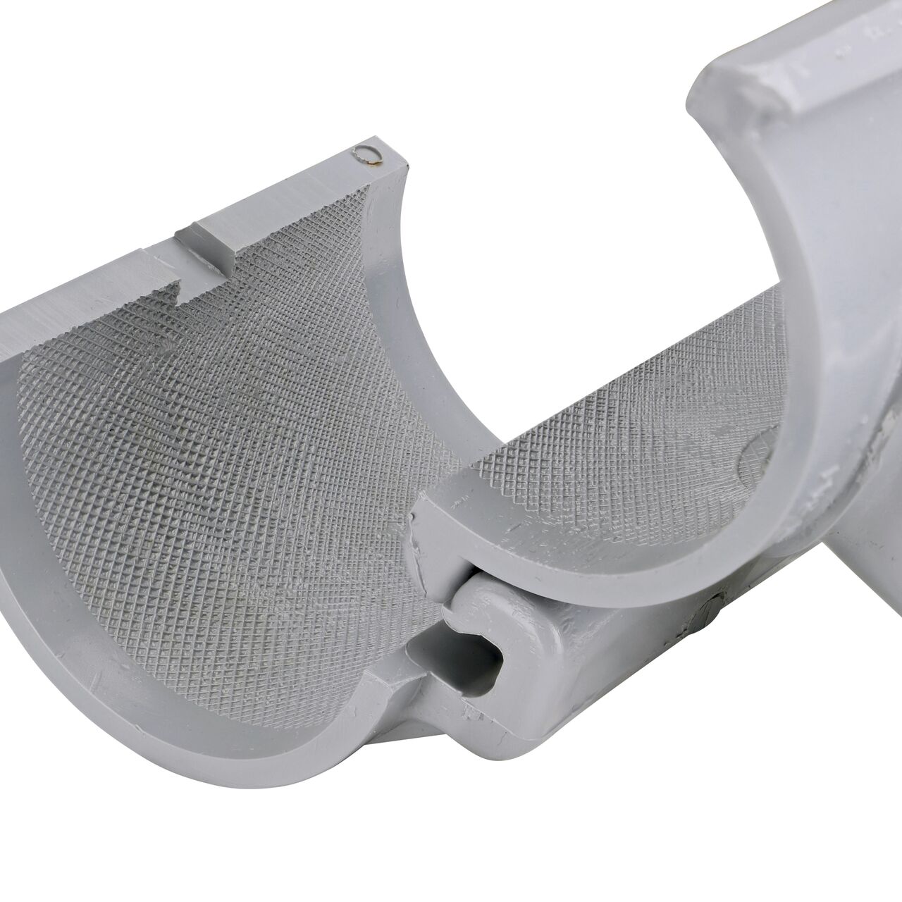 Closeup view of the hinge on the 2-1/2 in. NDS Flo-Tap™ Rigid PVC saddle with 1-1/2 in. socket or 2 in. spigot connection on top (NDS 3225) in the opened position that allows for easy installation onto Schedule 40 or Schedule 80 PVC pipe