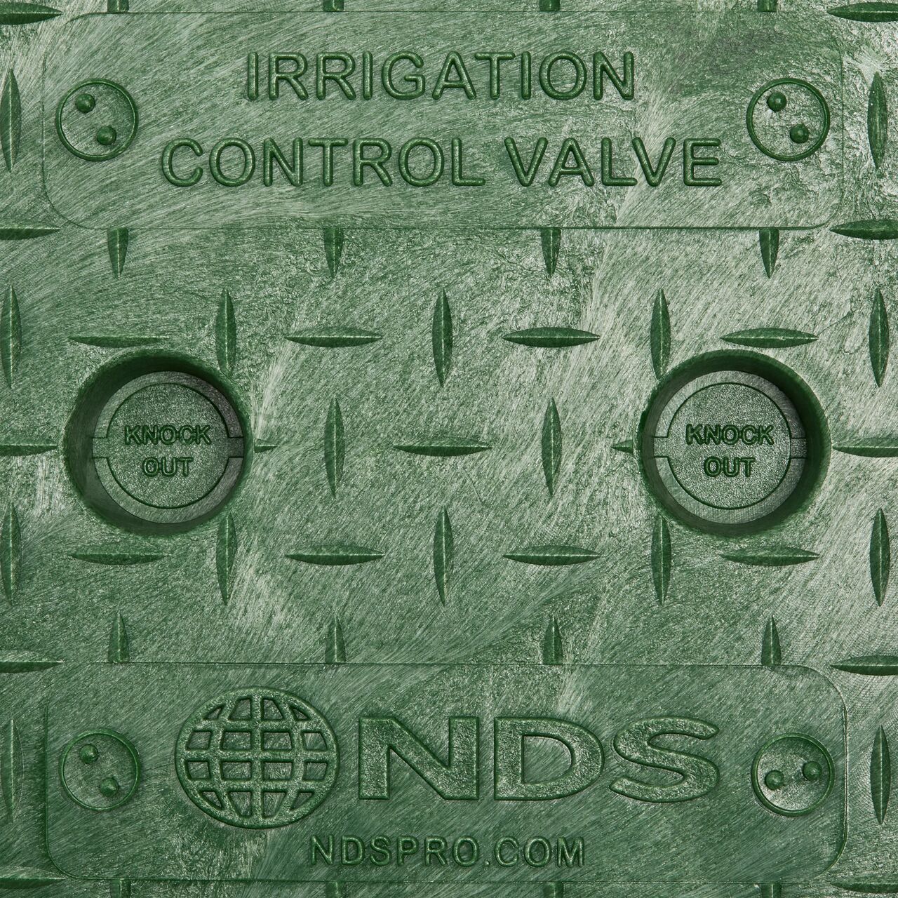 Closeup view of the Green Irrigation Control Valve markings and the fingerholes on the cover for the NDS 6 in. Round Standard Series Valve Box (NDS 2108BC)