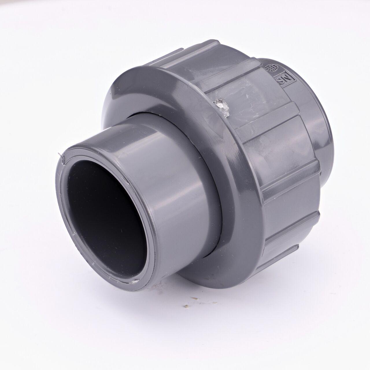 One end of the PVC Union, 1 in. Sch. 80 S X FPT which connects two 1 in. Sch. 80 pipes together to allow water to flow through while preventing leaks (NDS U-1000-ST)