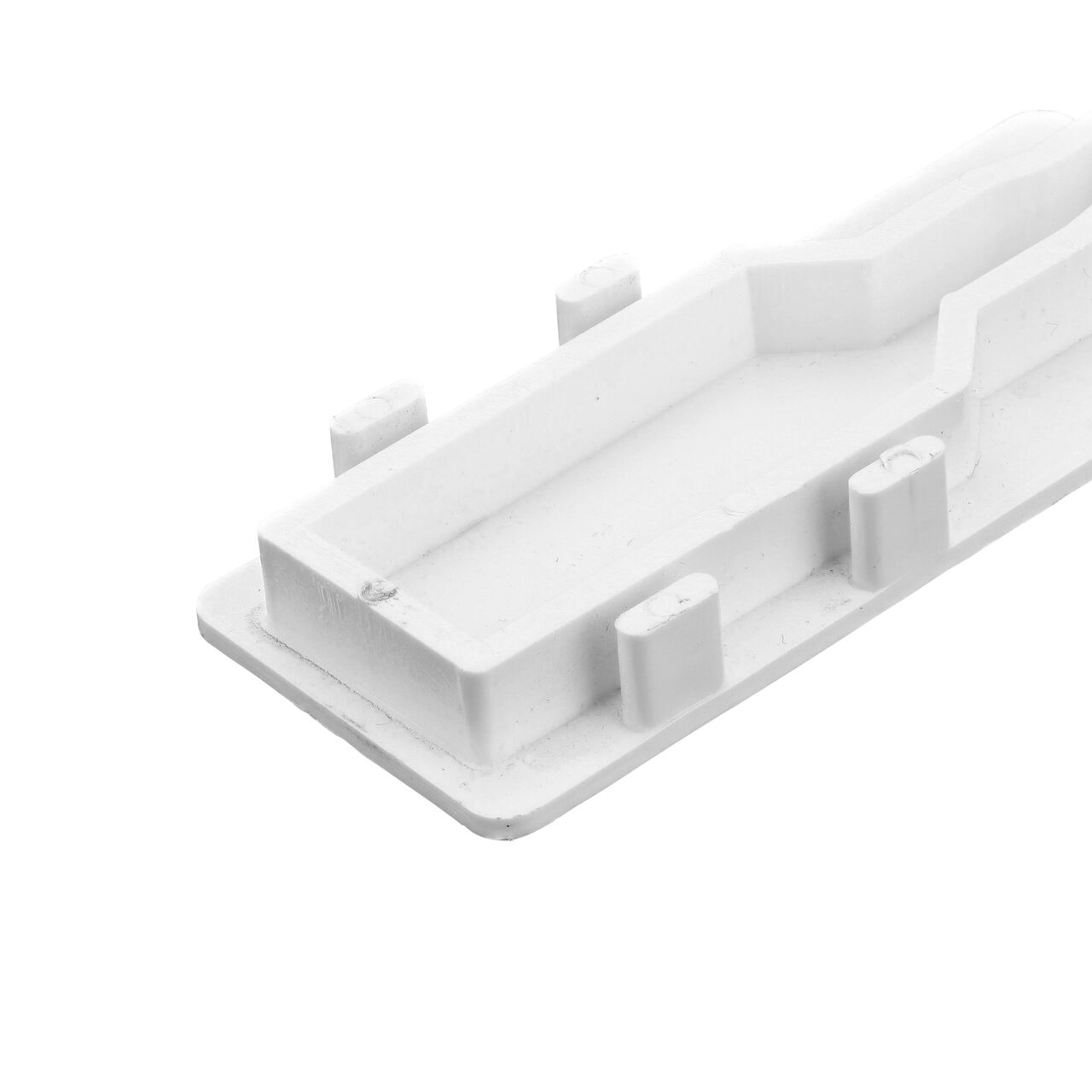 Closeup of the tabs in the back of the  NDS White Micro Channel™ Drain End Plug (NDS 8471)