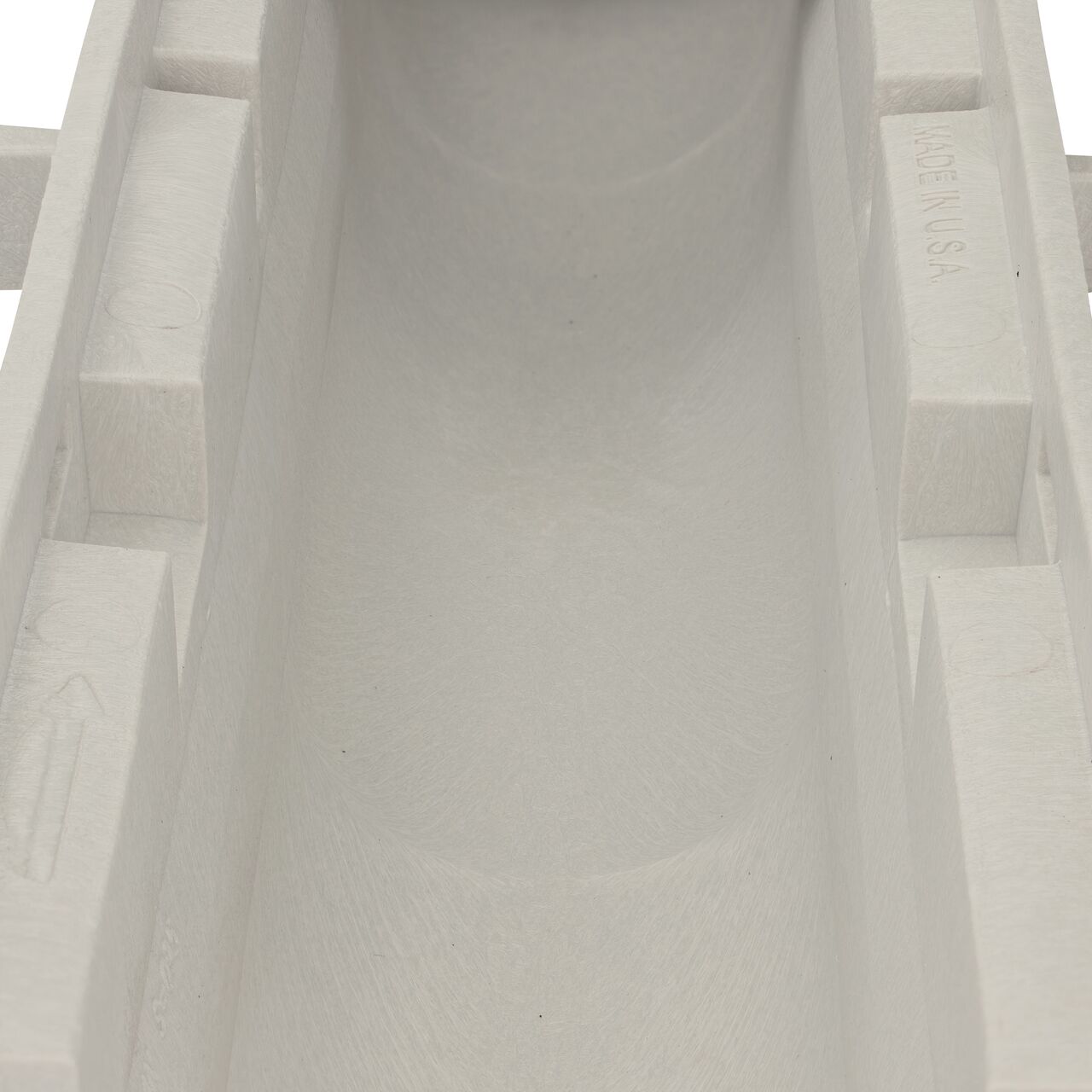 Closeup view of the grooved interior on the NDS Dura Slope Channel Drain, which supports and secures grates with the grate locking system (NDS DS-094N)