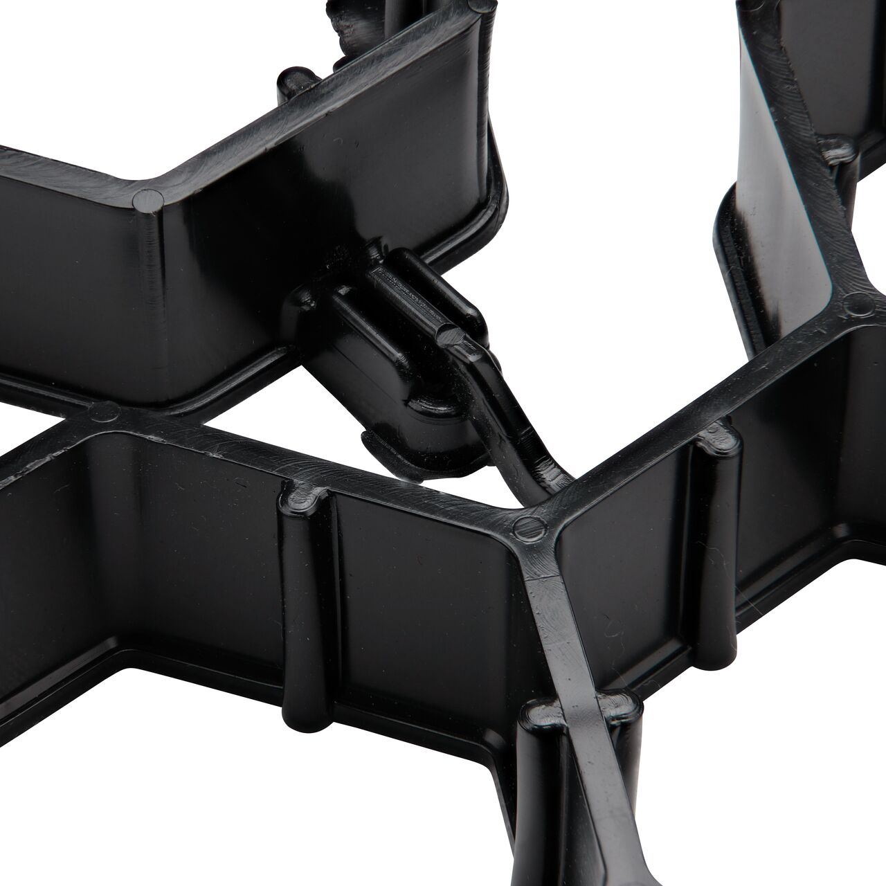 Closeup view of the end to end hook style locking mechanism securely connected on the NDS EZ Roll® Grass Pavers