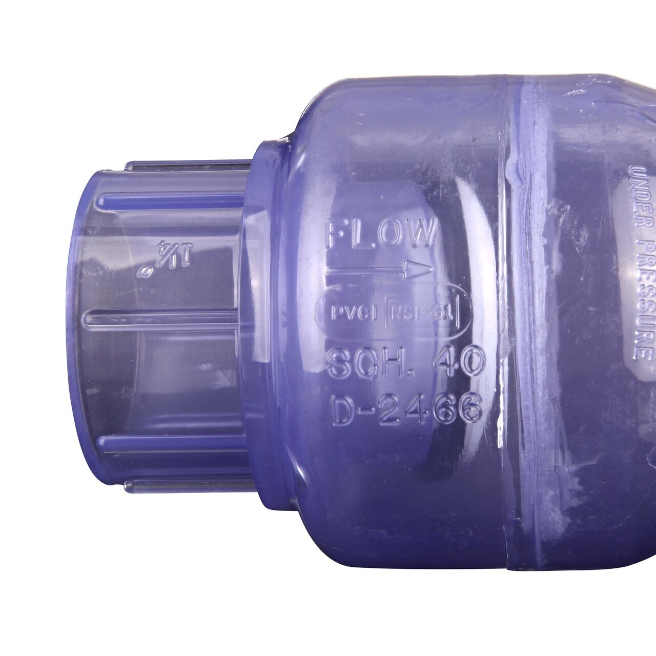 Closeup of the arrow showing water flow direction on the NDS Clear 1-1/4 in. slip end by slip end PVC Swing Check Valve (NDS 1520C12)