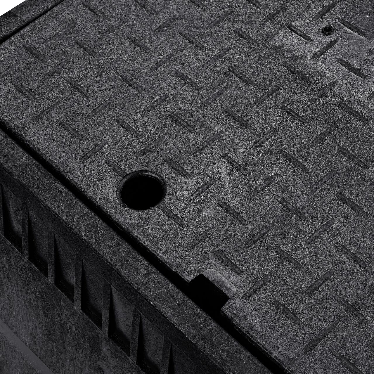 The drop-in meter box lid securely in place on the NDS 13 in. X 20 in. Rectangular Standard Series Black Meter Box and Black Water Meter Cover with Plastic reader door (NDS D1500-DUDISB) keeping components protected against the elements, foot traffic, lawn care equipment, and potential vandalism while keeping them out of sight